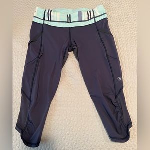Lululemon capri running leggings. Purple w/ light blue multi waistband. Size 6